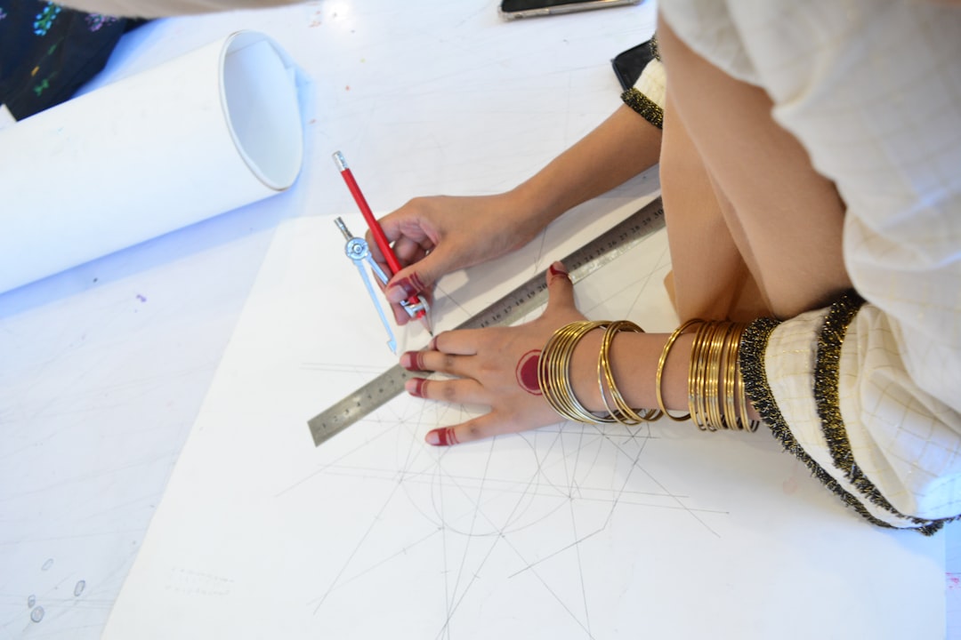 young woman creating interior design plan on tablet