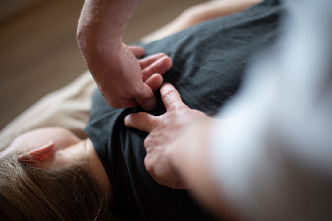 person practicing massage technique