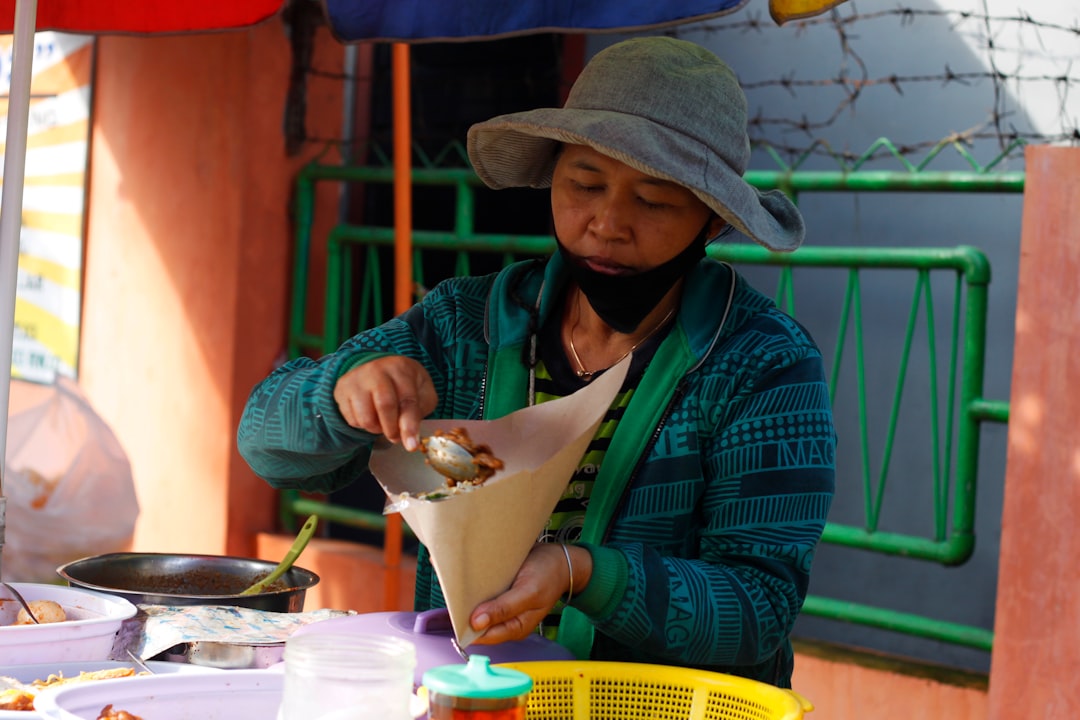 woman using smartphone to prepare tea